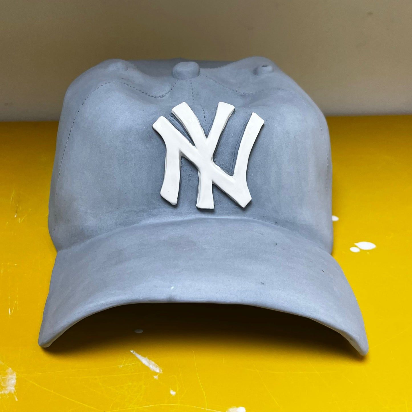 NY Yankees Ceramic Cap Sculpture (Grey) - Figurative Sculpture