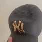 NY Yankees Ceramic Cap Sculpture (Black & Gold) - Figurative Sculpture